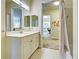 Bathroom with a vanity, shower, and access to other rooms at 1704 Triano Cir # 1704, Venice, FL 34292