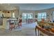 Open kitchen and breakfast nook with view of living room at 1704 Triano Cir # 1704, Venice, FL 34292