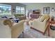 Relaxing living room with large windows and comfortable seating at 1704 Triano Cir # 1704, Venice, FL 34292