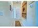 Bright and airy entryway with a decorative rug and wall art at 1704 Triano Cir # 1704, Venice, FL 34292