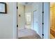 Well-lit hallway leading to bedroom and bathroom at 1704 Triano Cir # 1704, Venice, FL 34292