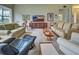 Comfortable living room with a large TV and comfortable seating at 1704 Triano Cir # 1704, Venice, FL 34292