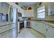 Modern kitchen with stainless steel appliances and granite countertops at 1704 Triano Cir # 1704, Venice, FL 34292