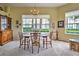 Charming dining area with classic furnishings and natural light at 1704 Triano Cir # 1704, Venice, FL 34292