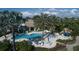 Aerial view of community pool, landscaping, and clubhouse at 1704 Triano Cir # 1704, Venice, FL 34292
