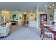 Open concept floorplan with living, dining, and kitchen areas at 1704 Triano Cir # 1704, Venice, FL 34292