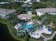 Aerial view showing community pool and surrounding buildings at 1704 Triano Cir # 1704, Venice, FL 34292
