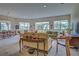 Open living room with large windows and comfortable furniture at 1704 Triano Cir # 1704, Venice, FL 34292