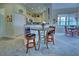 Kitchen breakfast nook with a round table and two chairs at 1704 Triano Cir # 1704, Venice, FL 34292