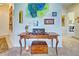 Elegant entryway with unique wall art and a console table at 1704 Triano Cir # 1704, Venice, FL 34292