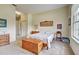 Main bedroom with large window, ample natural light, and carpet flooring at 1704 Triano Cir # 1704, Venice, FL 34292