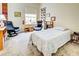 Bright bedroom featuring a bed, chair, and large window at 1704 Triano Cir # 1704, Venice, FL 34292