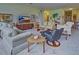 Spacious living area featuring ample seating and a large TV at 1704 Triano Cir # 1704, Venice, FL 34292