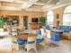 Relaxing community room with wicker furniture, large windows, and a spacious layout at 1704 Triano Cir # 1704, Venice, FL 34292