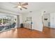 Living room featuring hardwood floors and sliding doors to patio at 4835 Jacaranda Heights Dr, Venice, FL 34293