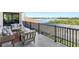 This is a balcony with a partial water view and seating area at 1109 Bayshore Rd, Nokomis, FL 34275