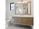 Modern bathroom with floating vanity and large mirror at 1109 Bayshore Rd, Nokomis, FL 34275