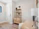Well-lit home office with a modern desk, stylish shelving, and neutral decor at 1109 Bayshore Rd, Nokomis, FL 34275