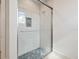 Contemporary walk-in shower with glass door, mosaic tile accents, and modern fixtures at 1109 Bayshore Rd, Nokomis, FL 34275