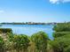 Scenic waterfront view with lush greenery and homes at 1109 Bayshore Rd, Nokomis, FL 34275