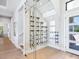 This is a modern wine cellar located next to the stairs and front door at 1109 Bayshore Rd, Nokomis, FL 34275