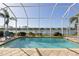 Inviting screened-in pool with lake view at 11149 Staveley Ct, Venice, FL 34293