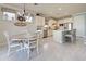 Bright kitchen with island, stainless steel appliances, and white cabinetry at 13848 Rinuccio St, Venice, FL 34293