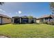 View of house and backyard, perfect for outdoor activities at 13848 Rinuccio St, Venice, FL 34293