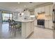 Spacious kitchen boasts an island, stainless steel appliances, and breakfast nook at 13848 Rinuccio St, Venice, FL 34293