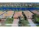 Aerial view showcasing a desirable neighborhood of homes with attractive architecture and landscaping at 13848 Rinuccio St, Venice, FL 34293