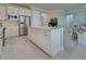 Bright kitchen features an island and stainless steel appliances at 13848 Rinuccio St, Venice, FL 34293