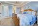 Spacious Primary bedroom with a large bed and en-suite bathroom access at 13848 Rinuccio St, Venice, FL 34293