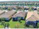 Aerial view of houses featuring backyard and canal views at 13848 Rinuccio St, Venice, FL 34293