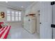 Bright and airy office with large windows, white furniture, and nautical-themed decor at 13848 Rinuccio St, Venice, FL 34293
