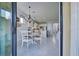 Bright dining area with a view into the kitchen and access to the outside at 13848 Rinuccio St, Venice, FL 34293