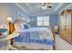 Large bedroom with king bed, calming blue decor, and ample closet space at 13848 Rinuccio St, Venice, FL 34293