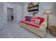 Relaxing office features a couch with American flag throw and decorative shelf at 13848 Rinuccio St, Venice, FL 34293