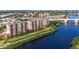 Beautiful aerial view of waterfront condos featuring lush landscaping and convenient bridge access at 147 Tampa E Ave # 202, Venice, FL 34285
