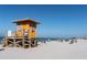 A picturesque beach view with lifeguard stand, inviting residents to enjoy sun, sand, and surf at 147 Tampa E Ave # 202, Venice, FL 34285