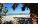 Picturesque beach view with a wooden boardwalk leading to a pier, perfect for a relaxing day at 147 Tampa E Ave # 202, Venice, FL 34285