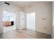 View of a bedroom featuring hardwood floors and an open doorway to the kitchen at 147 Tampa E Ave # 202, Venice, FL 34285