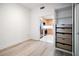 Bright bedroom featuring an open closet with wood drawers and hardwood floors at 147 Tampa E Ave # 202, Venice, FL 34285