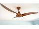 Unique ceiling fan with wooden blades and light fixture complements the ceiling at 147 Tampa E Ave # 202, Venice, FL 34285