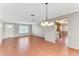 Living room with tile floors and a view to the kitchen and front door at 1507 N Knollwood Dr, Bradenton, FL 34208