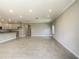 Spacious living area with tile flooring and access to the kitchen at 16851 Terrapin Key Dr, Port Charlotte, FL 33953