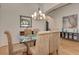 Spacious dining room featuring a glass-top table and coastal decor at 1724 Grande Park Dr, Englewood, FL 34223