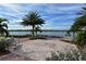 Relaxing waterfront view with benches and palm trees at 19177 Corradino Blvd, Venice, FL 34293