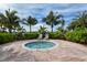 Community hot tub with lounge chairs and palm trees at 19177 Corradino Blvd, Venice, FL 34293