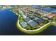 Aerial view of community with tennis courts and lake at 19177 Corradino Blvd, Venice, FL 34293