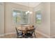 Bright breakfast nook featuring a round table and four chairs, perfect for enjoying morning meals at 19830 Bridgetown Loop, Venice, FL 34293